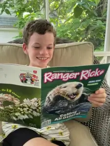 Girl holding magazine